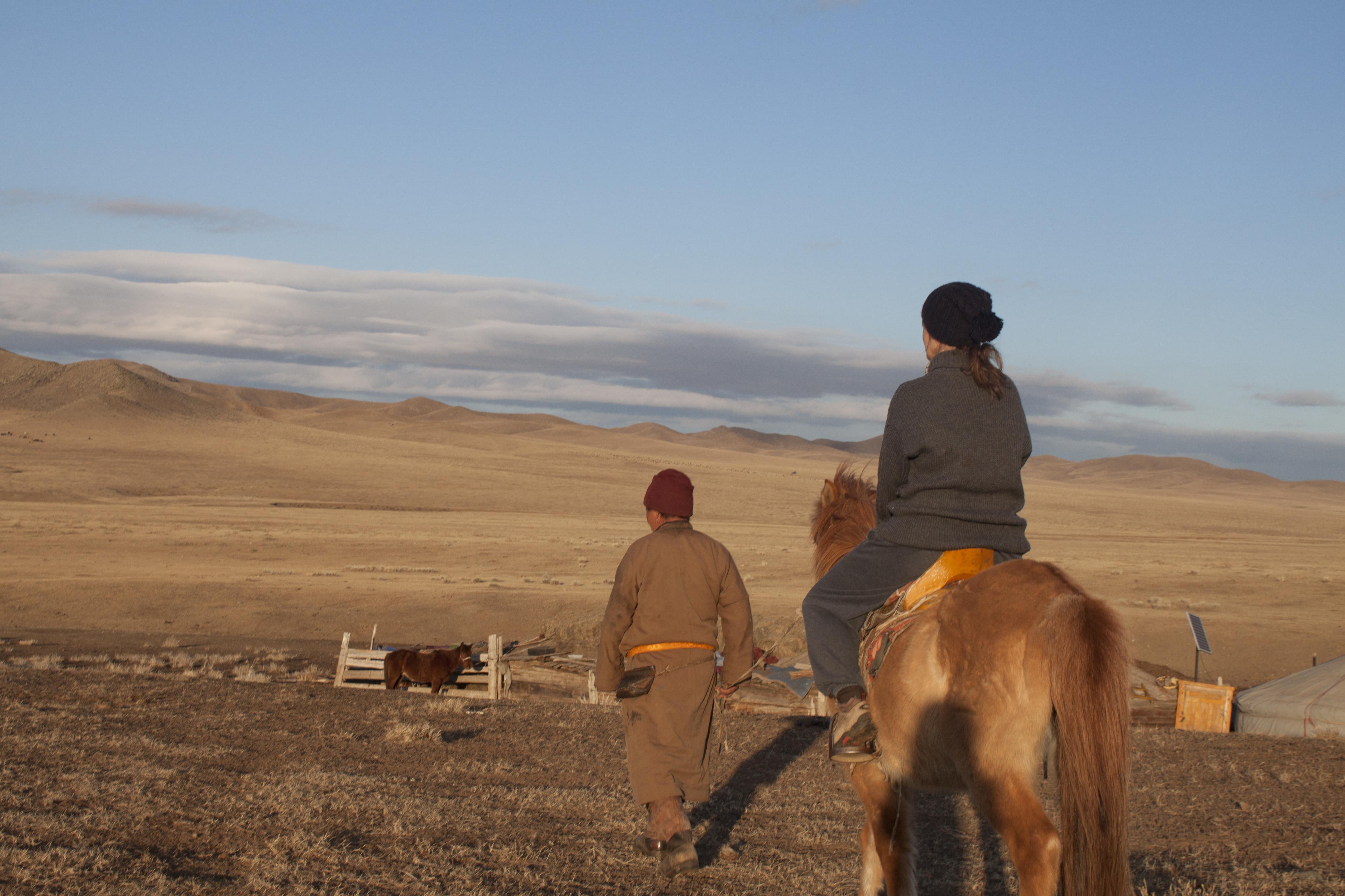 Nomads living on the Mongolian Steppe take care of their farm animals. 