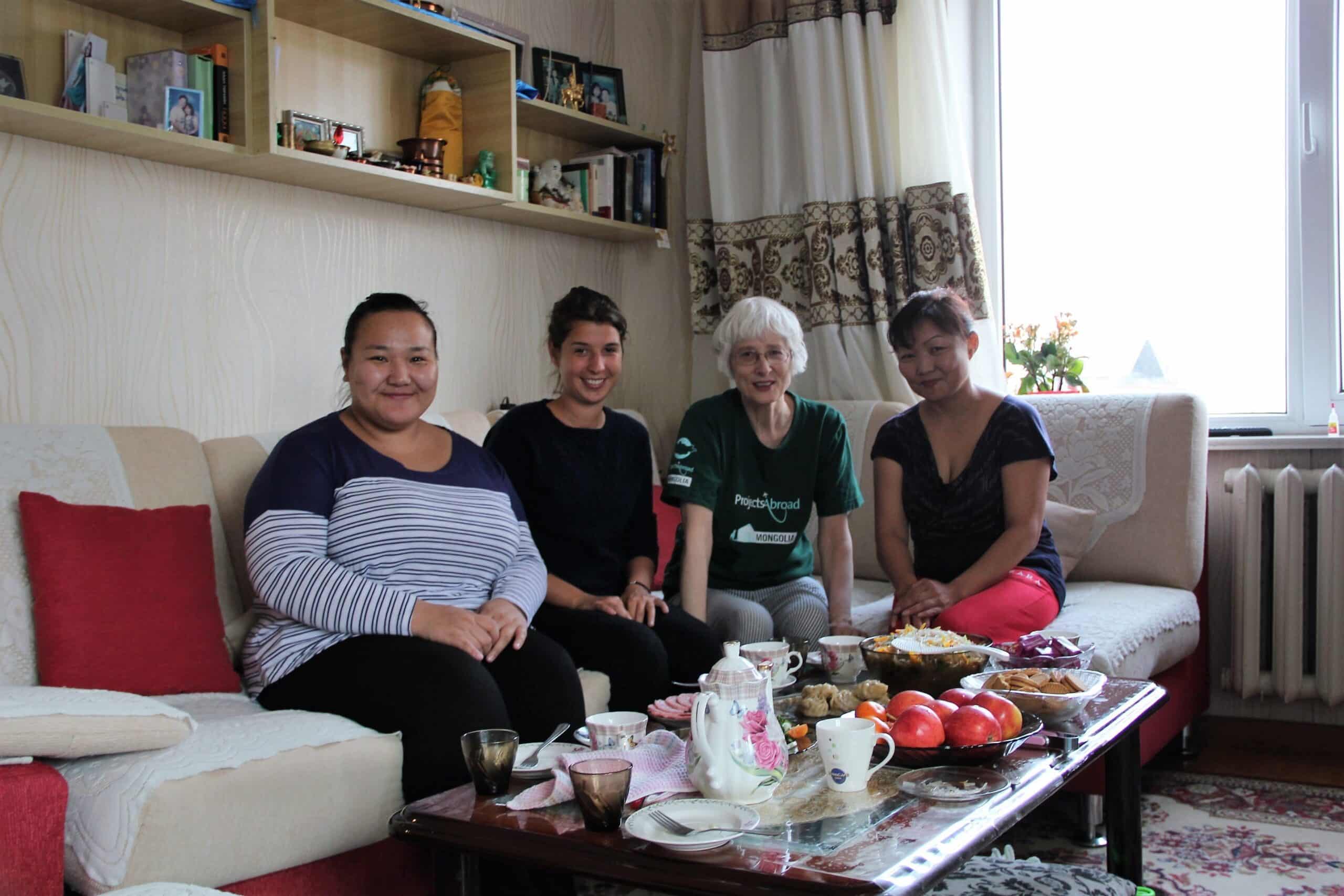 Retired volunteer with her host family in Mongolia