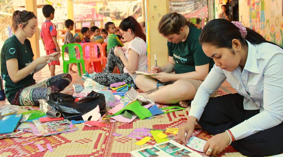 Volunteers helping with arts and crafts in Cambodia