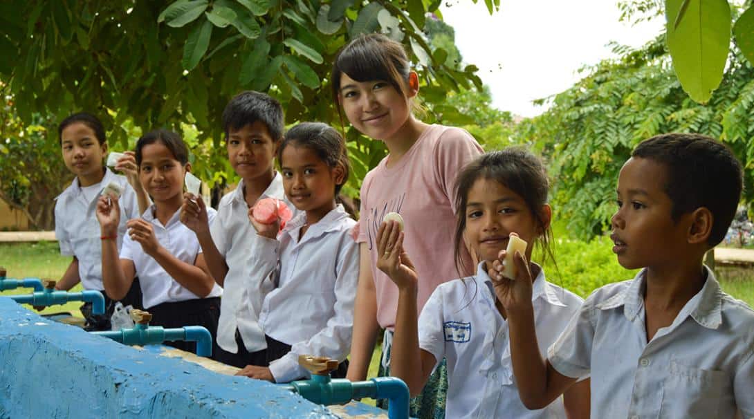 A volunteer leading a hygiene workshop with children in Cambodia