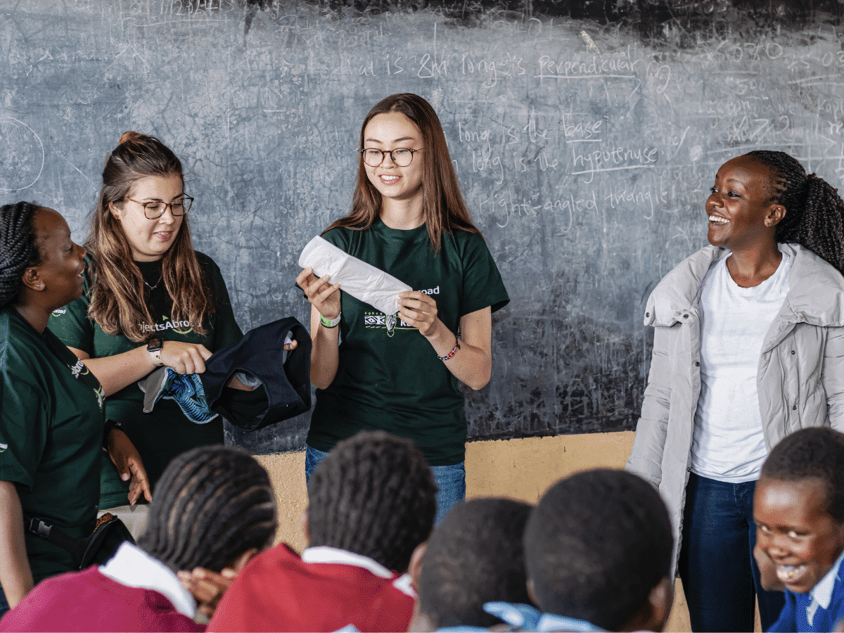 Kenya - Volunteer showing how to use female sanitary products