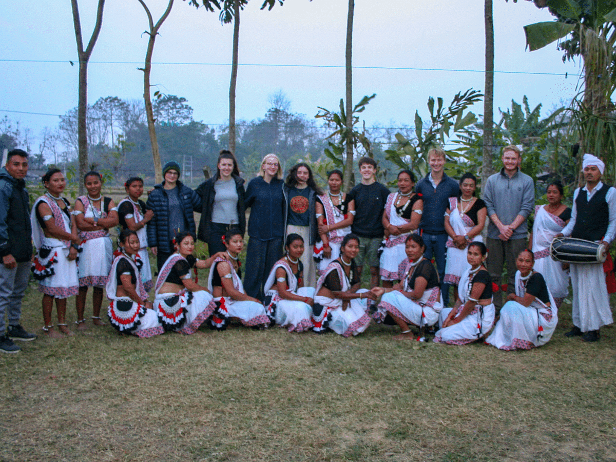 Nepal - volunteers and local people wearing traditional dress