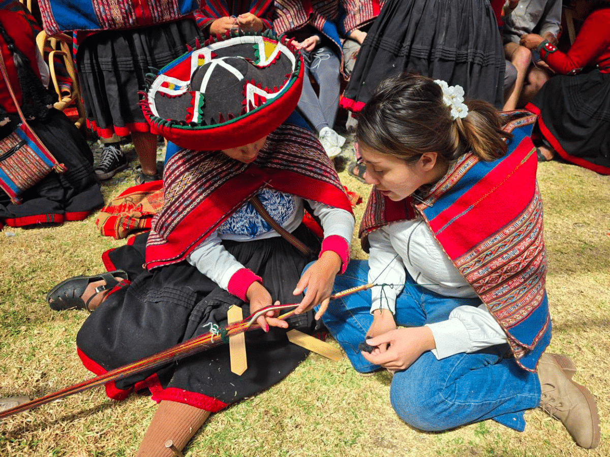 Volunteer being shown traditional crafts