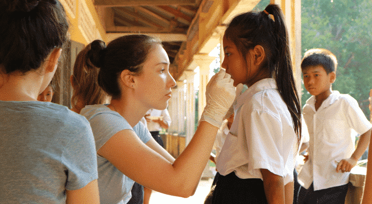 A volunteer conducts a health check