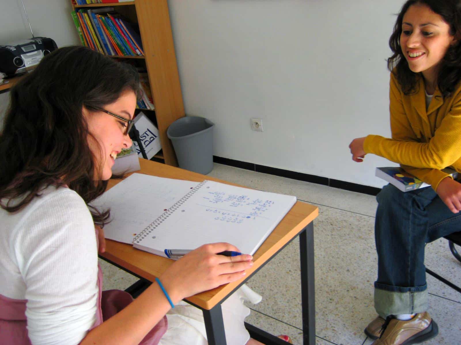 As part of her cultural exchange program abroad, a volunteer learns a new language.