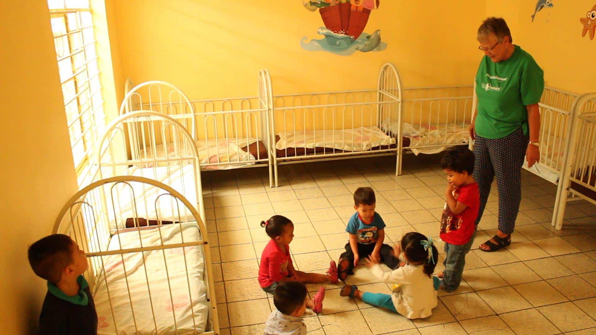 Romana supervising small children in her childcare placement.