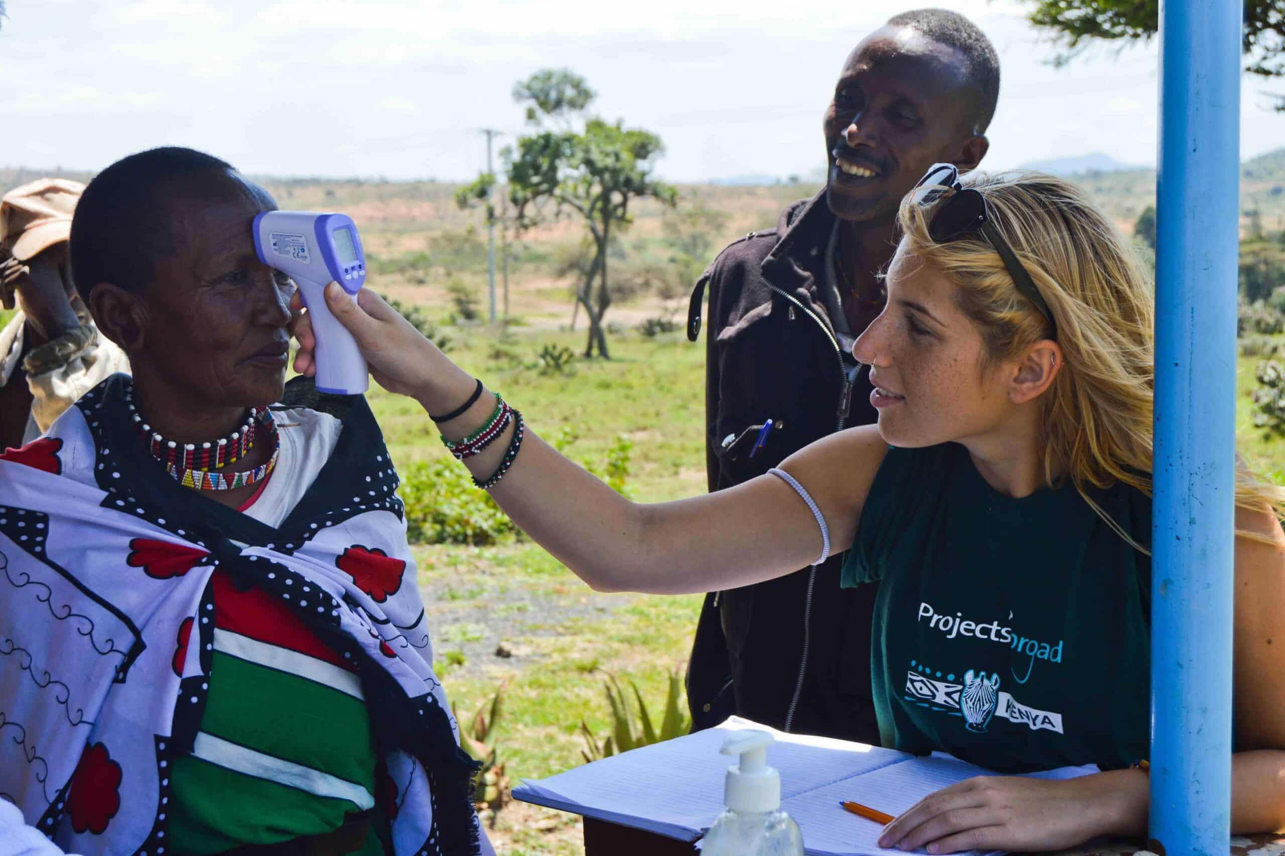 A Projects Abroad medical volunteer helps doctors and nurses with different medical tasks during a medical outreach in Kenya.