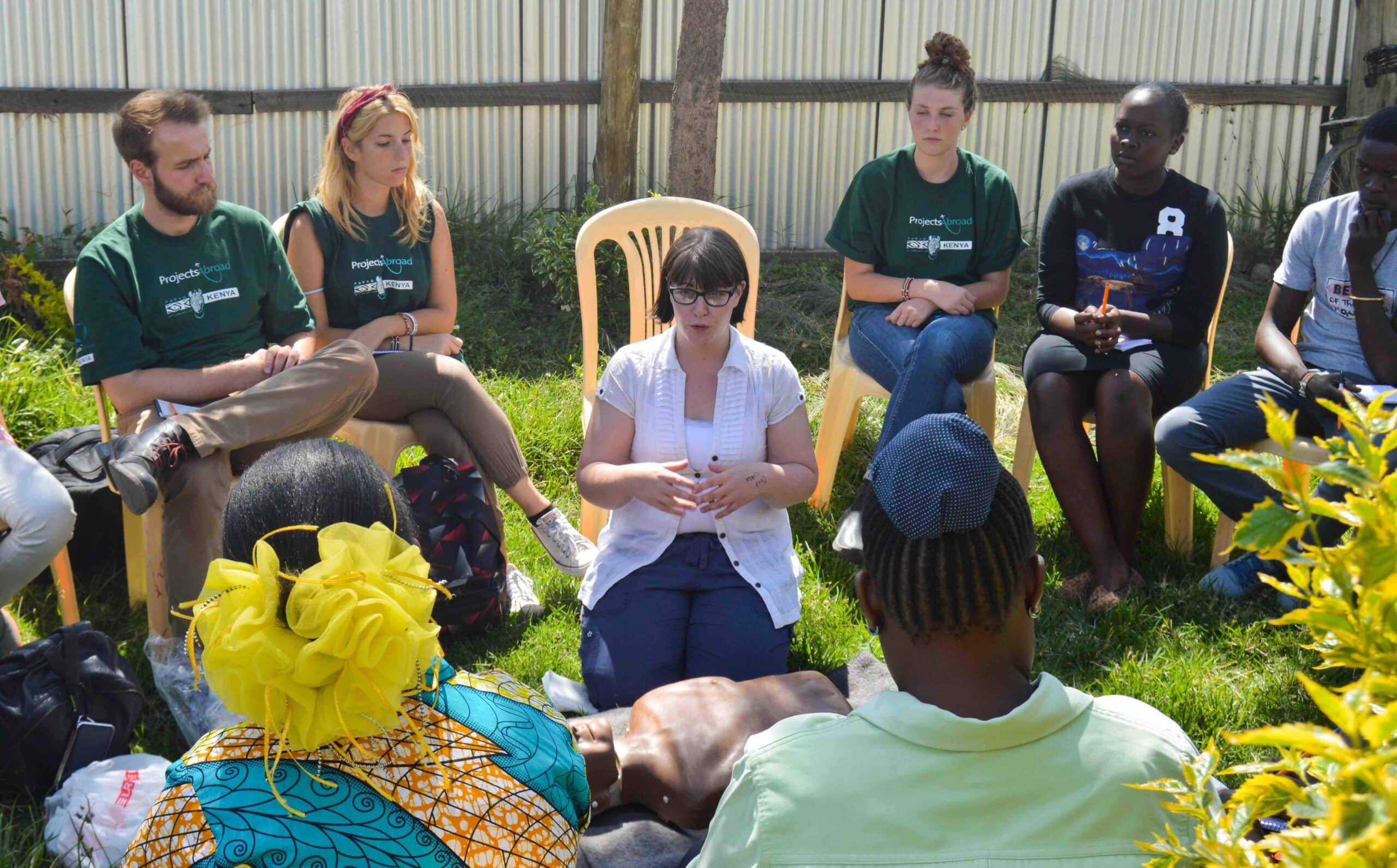 A group of Projects Abroad volunteers shadow a qualified therapist during a workshop in Kenya during their Occupational Therapy internship.