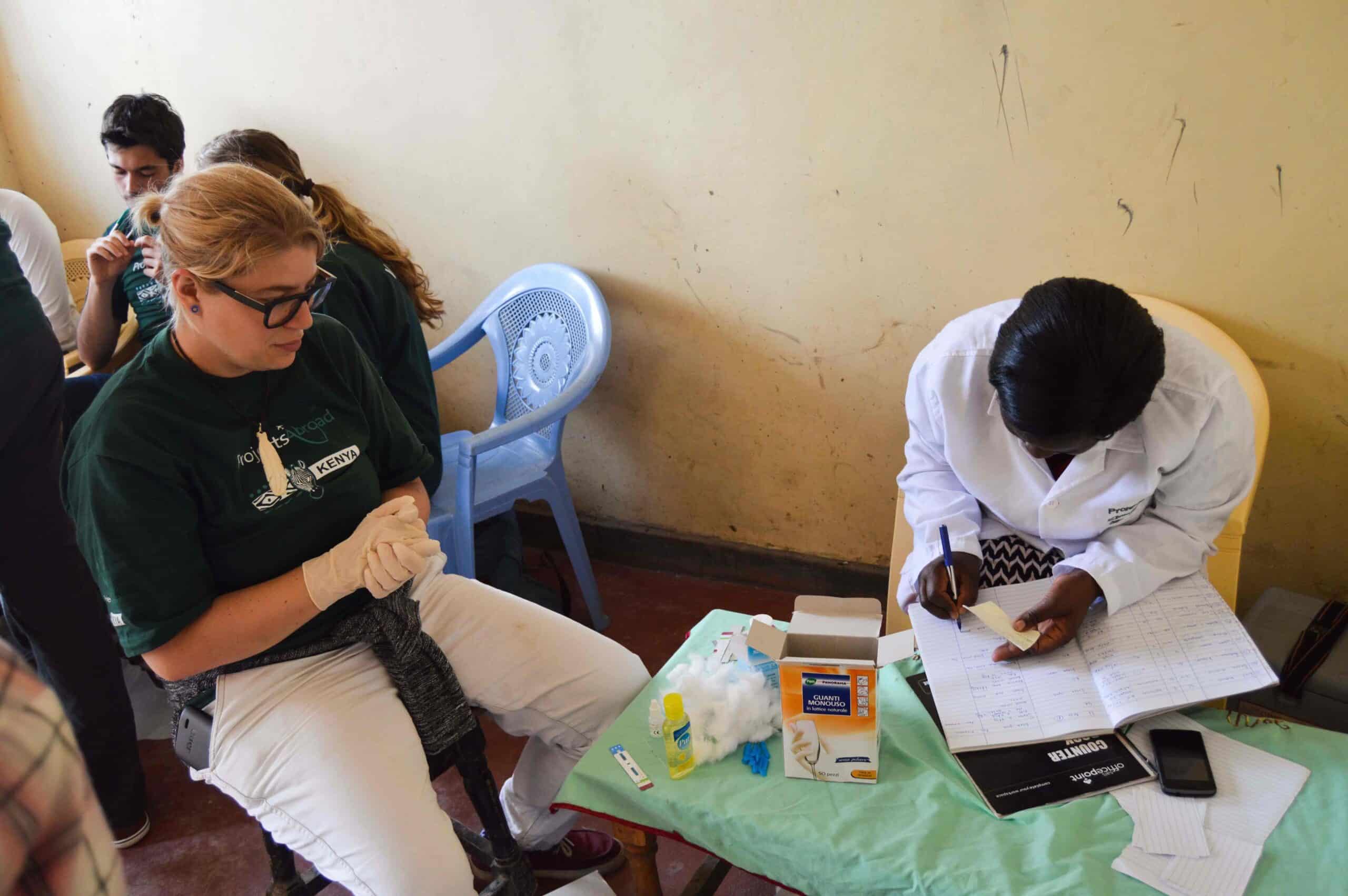 A Projects Abroad medical volunteer doing a Nursing Internship in Kenya shadows a local nurse.
