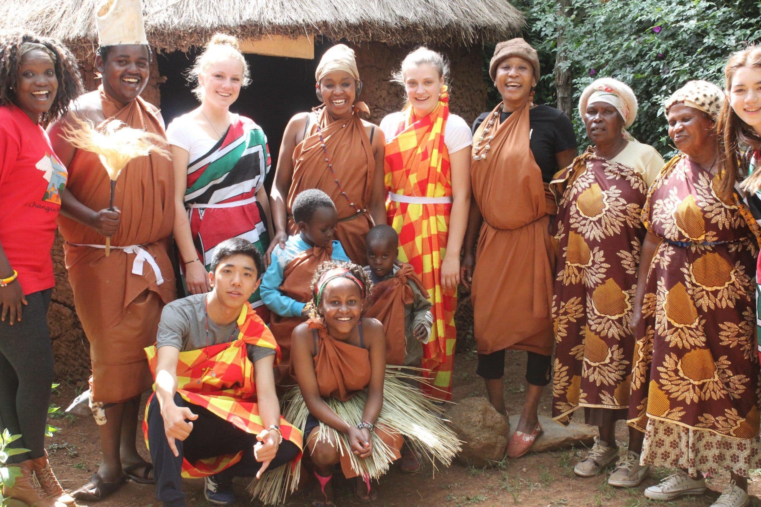 A group of teenage volunteers doing a care internship in Kenya with Projects Abroad experience local culture.