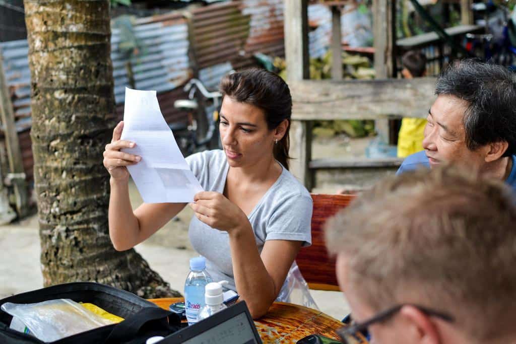 A Medical intern checks data in Cambodia