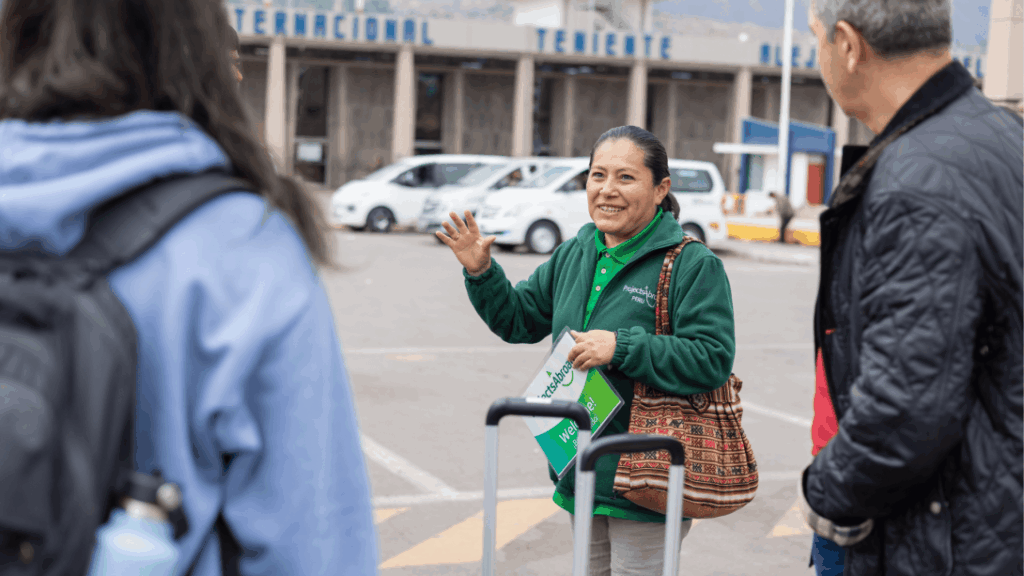 Projects Abroad volunteer receives a monk's blessing in Cambodia Staff welcoming a new volunteer at the airport in Peru