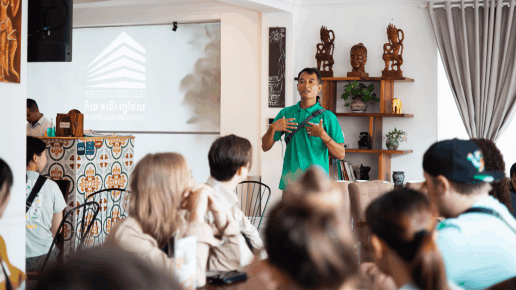 Projects Abroad volunteer receives a monk's blessing in Cambodia Projects Abroad staff giving an induction talk in Cambodia